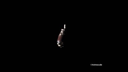 A far-away photograph of silver space debris