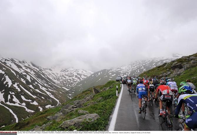 The peloton is surrounded my mountains en route of the Tour de Suisse
