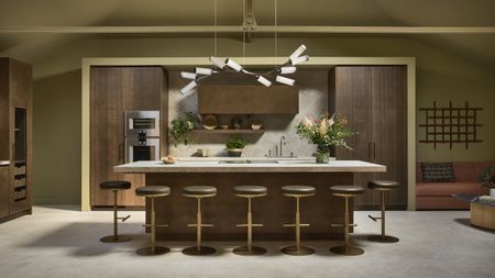 dark wood kitchen with island and statement lighting
