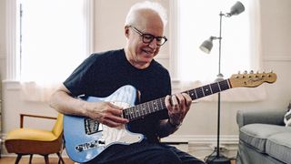 Bill Frisell poses at home with a customized Fender Telecaster