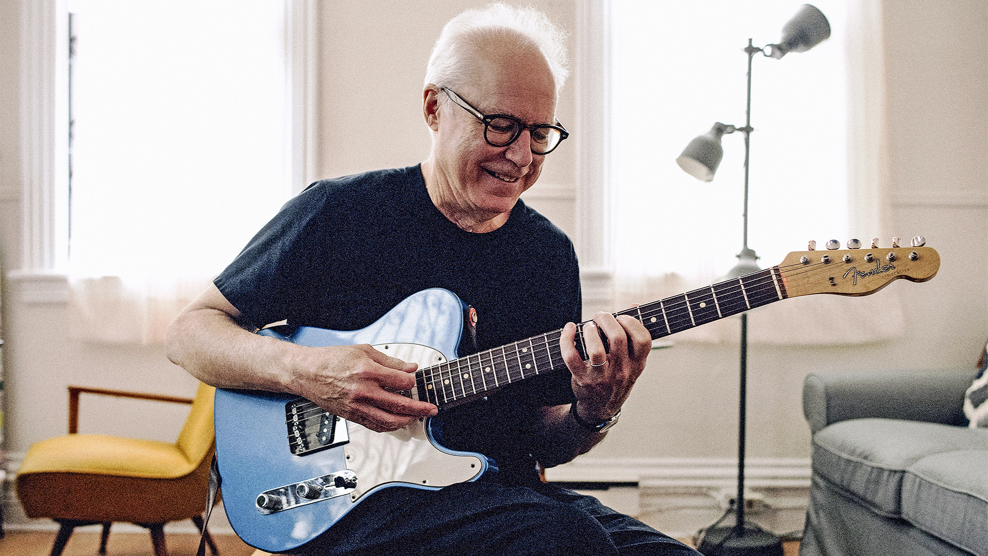 Bill Frisell poses at home with a customized Fender Telecaster