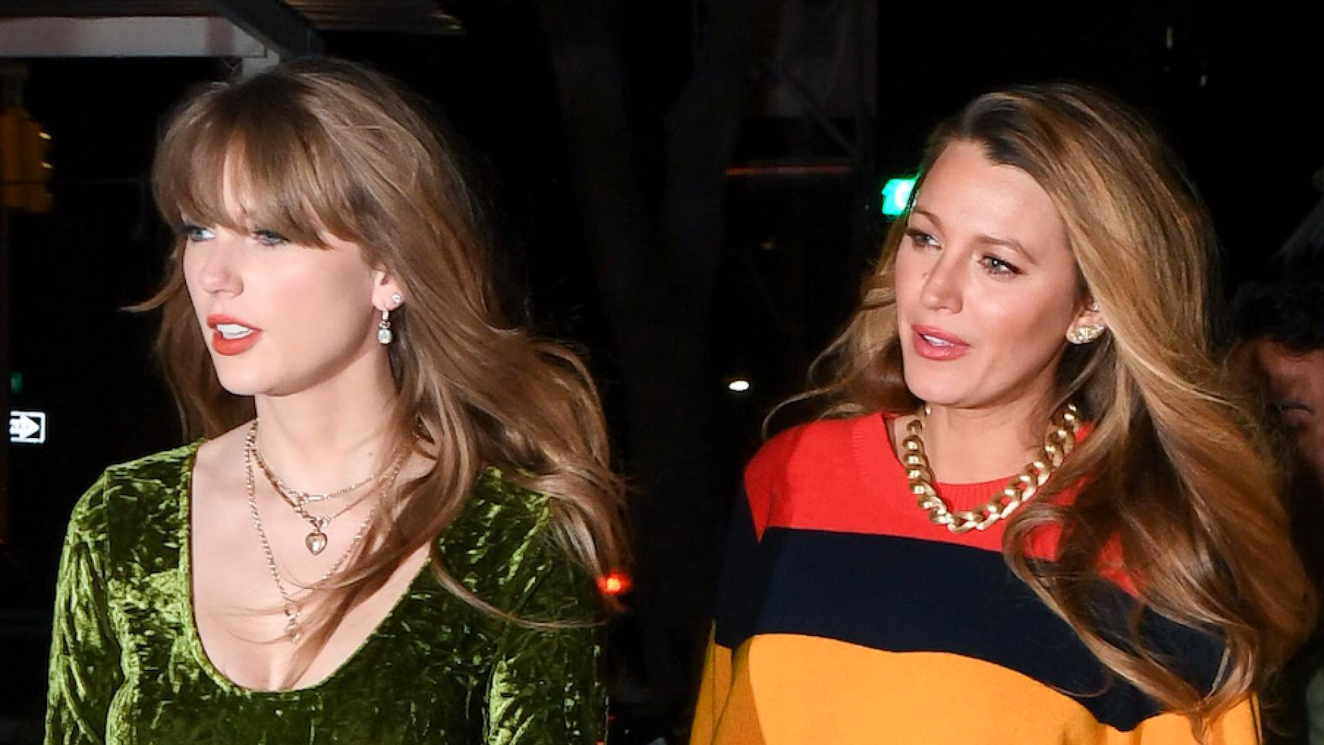 Taylor Swift wears a green velvet dress and walks with Blake Lively, who is wearing a red and orange sweater