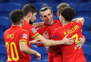 Wales' David Books celebrates his winner against Ireland with Gareth Bale (centre) and their team-mates