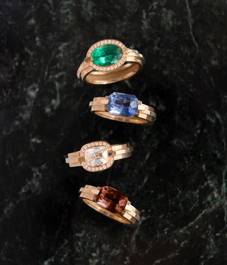 four diamond engagement rings with different coloured stones