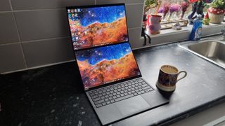An Asus Zenbook Duo laptop with both of its OLED screens deployed