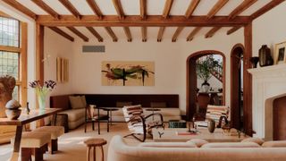 a living room with tudor beamed ceiling and modern neutral furniture interior rye New York.