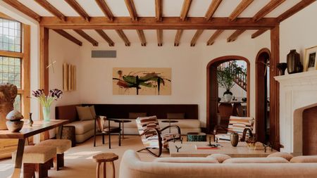 a living room with tudor beamed ceiling and modern neutral furniture interior rye New York.