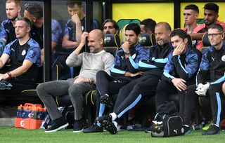 Pep Guardiola on the Manchester City bench