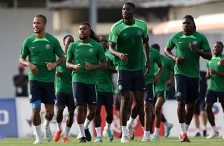 Nigeria's midfielder Alexander Chuka Iwobi (2L) runs with teammates during a training session at the National Police School stadium in Abidjan on February 10, 2024 on the eve of the 2024 Africa Cup of Nations (CAN) final football match between Ivory Coast and Nigeria. (Photo by FRANCK FIFE / AFP) (Photo by FRANCK FIFE/AFP via Getty Images)