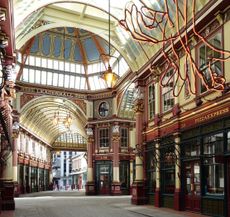 The few markets that remain in central London are often spectacular. Leadenhall Market was built in 1880–81 to the design of Sir Horace Jones, also architect of the earlier Smithfield and Billingsgate markets. It occupies part of the former site of the basilica of the 2nd-century Roman forum that was redeveloped in the Middle Ages as a grain store and market. The shop frontages are of iron and the asymmetry of plan is inherited from the existing street plan.