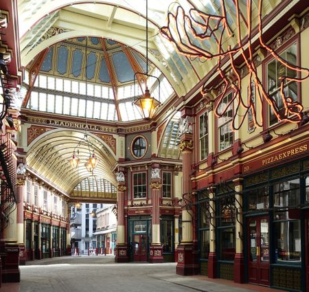 The few markets that remain in central London are often spectacular. Leadenhall Market was built in 1880–81 to the design of Sir Horace Jones, also architect of the earlier Smithfield and Billingsgate markets. It occupies part of the former site of the basilica of the 2nd-century Roman forum that was redeveloped in the Middle Ages as a grain store and market. The shop frontages are of iron and the asymmetry of plan is inherited from the existing street plan.