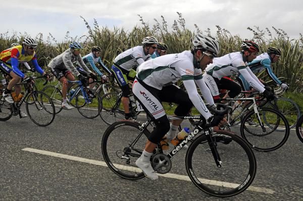 The peloton battles strong head winds