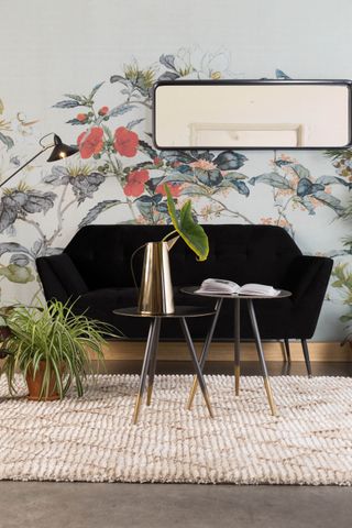 living room with stunning floral feature wall, wine coloured sofa and nice mirror by cuckooland