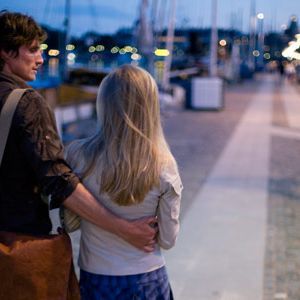 couple walking on a pier
