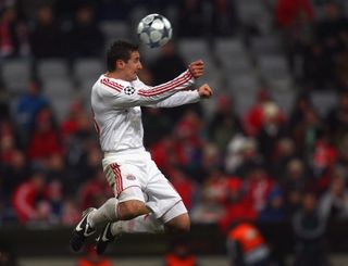 Miroslav Klose jumps for a header in a Champions League match for Bayern Munich against Sporting CP in March 2009.