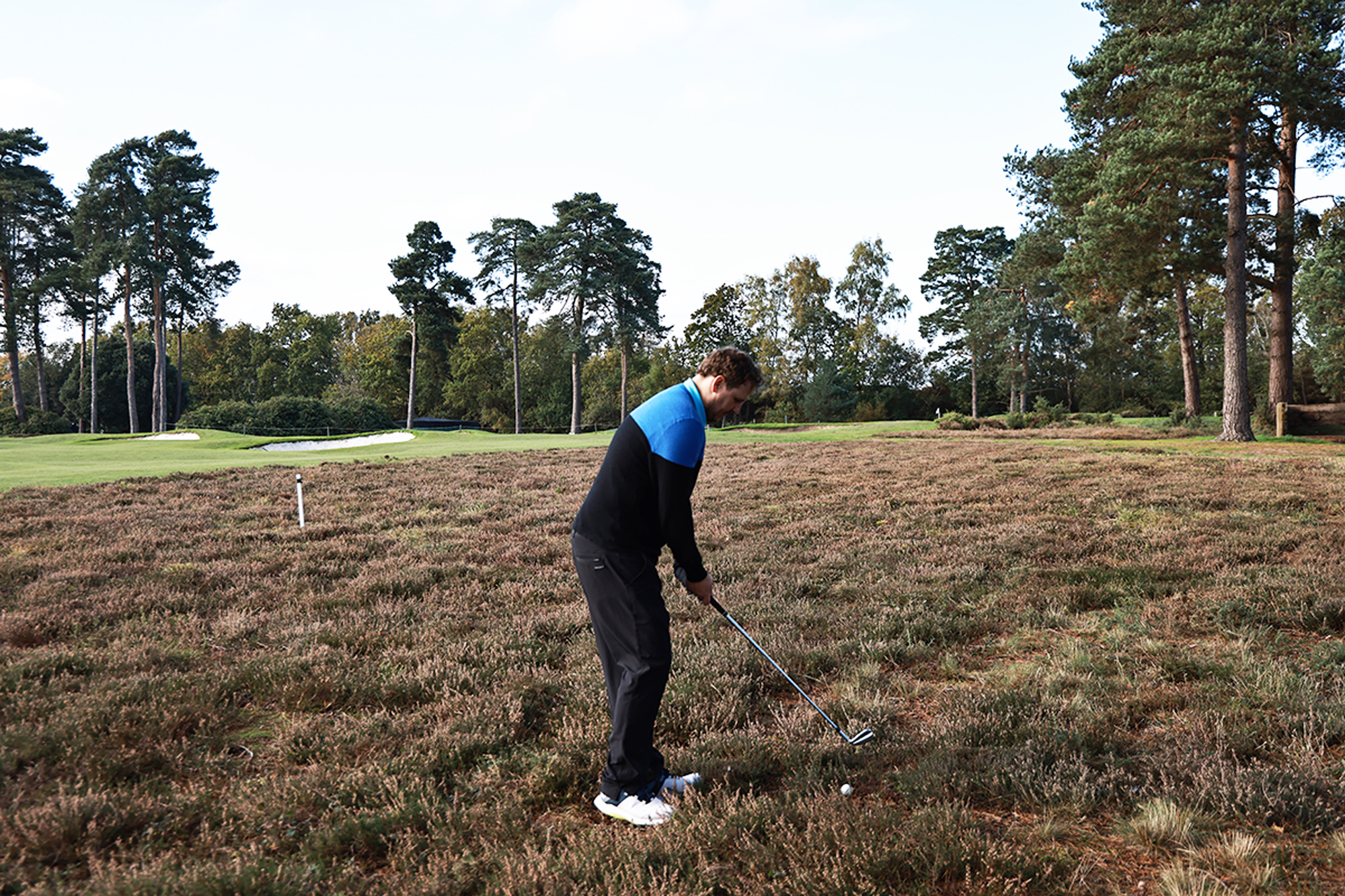 Nick Bonfield hitting a shot out of the gorse rough at West Hill Golf Club