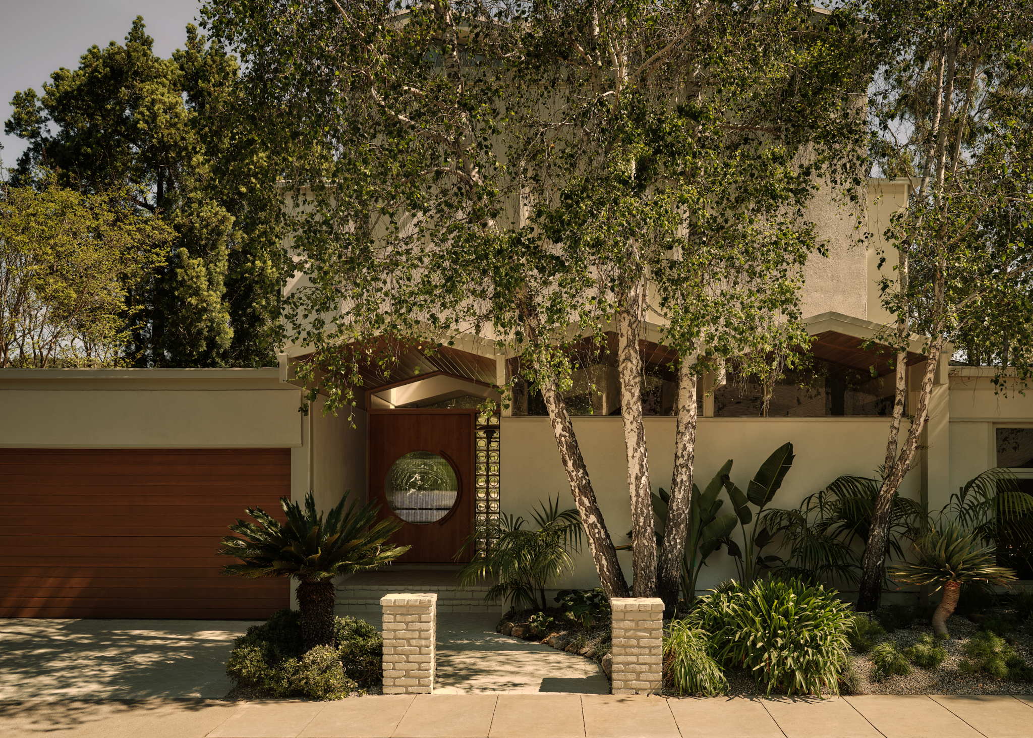 Front of the two-storey white-washed house in Hollywood
