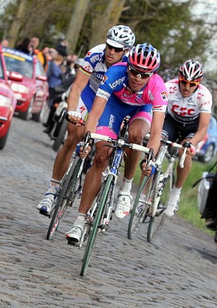 Ballan leads as Cancellara makes it from the left to the right side of the road.