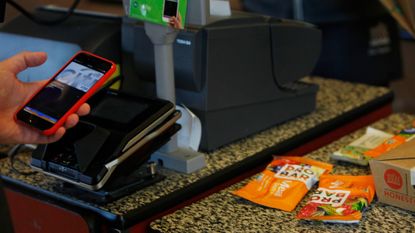 A customer uses Apple Pay at a Whole Foods in San Francisco. 