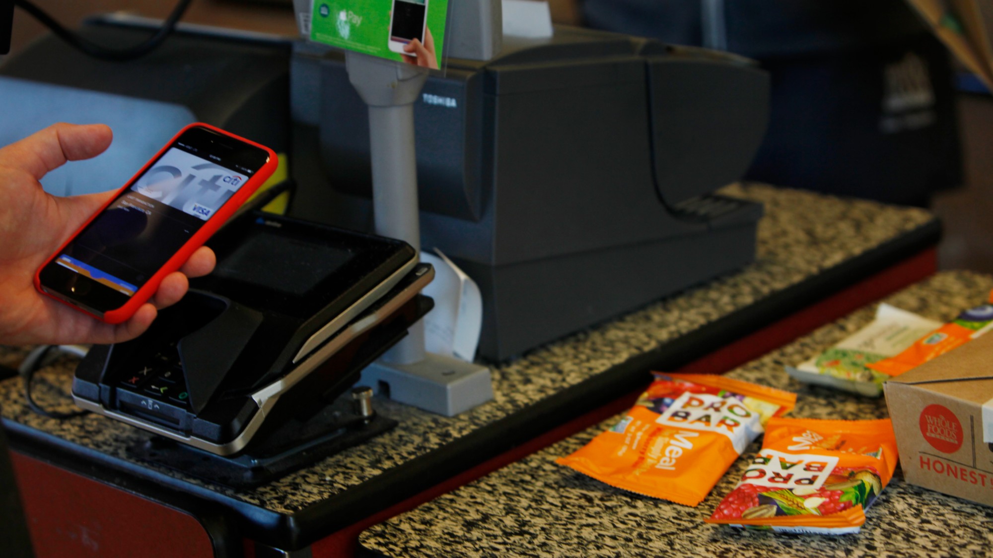 A customer uses Apple Pay at a Whole Foods in San Francisco. 