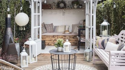 Outdoor garden area with white and wood decor