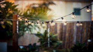 String lights hung above a patio