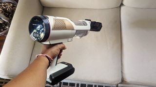 Shark Cordless Detect Pro handheld being tested in writer's home