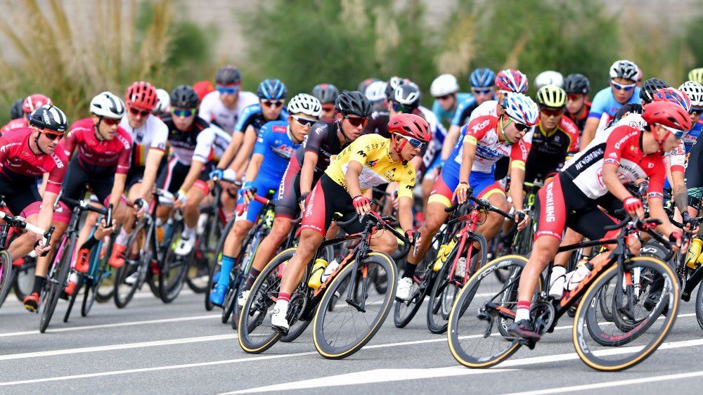The peloton rounds a corner