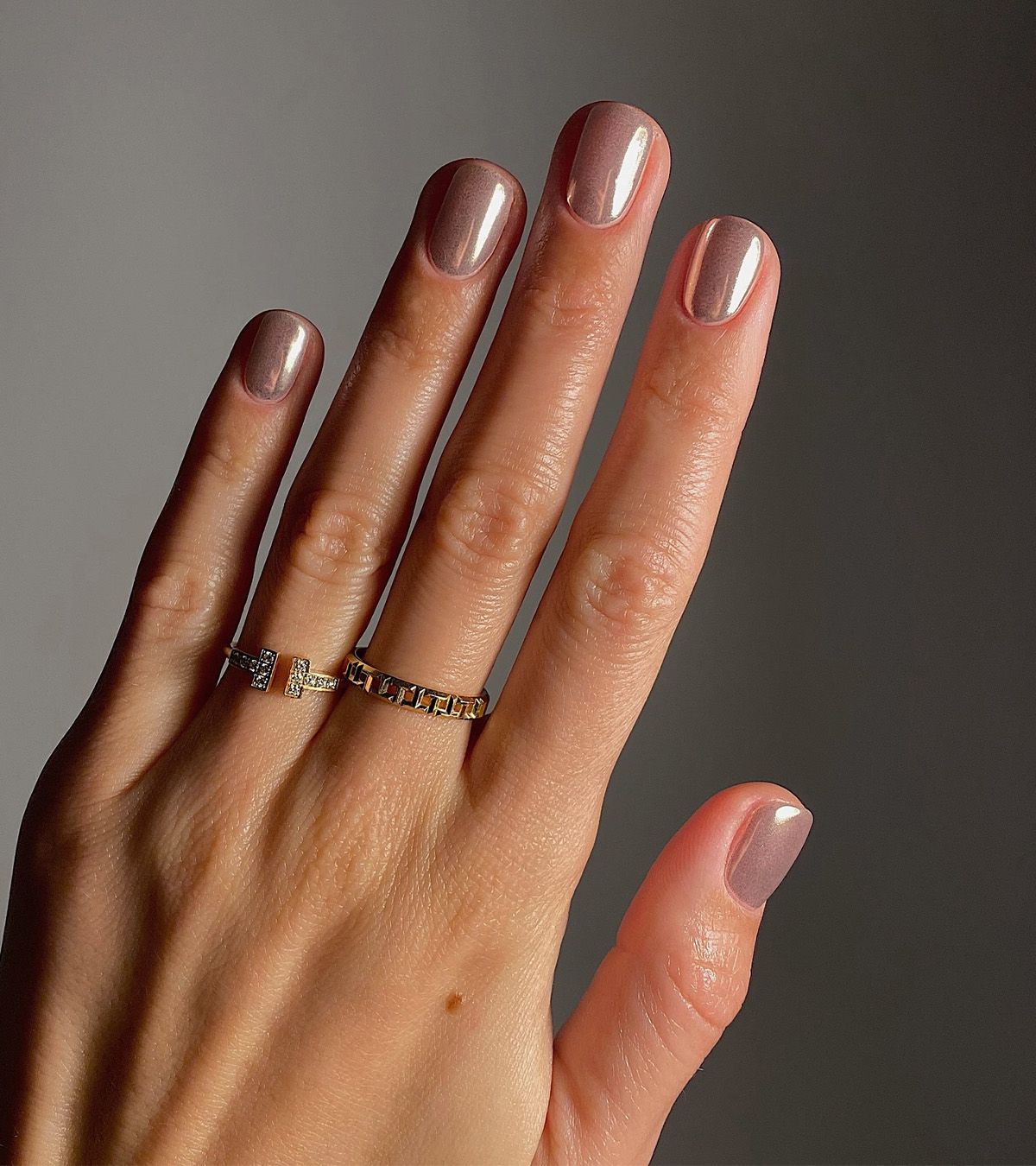 A sheer pink manicure with chrome powder by Mateja Novakovic.