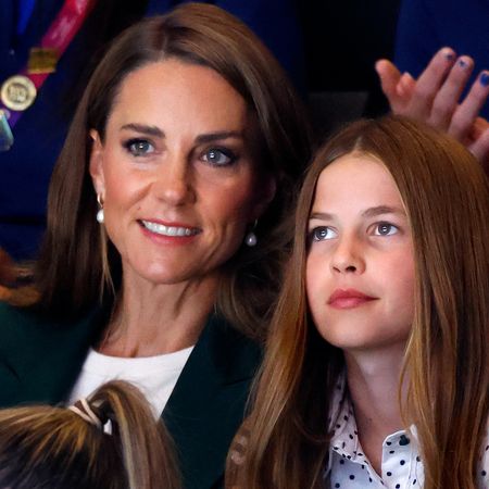 Princess Kate and Princess Charlotte sitting next to each other at the Commonwealth Games