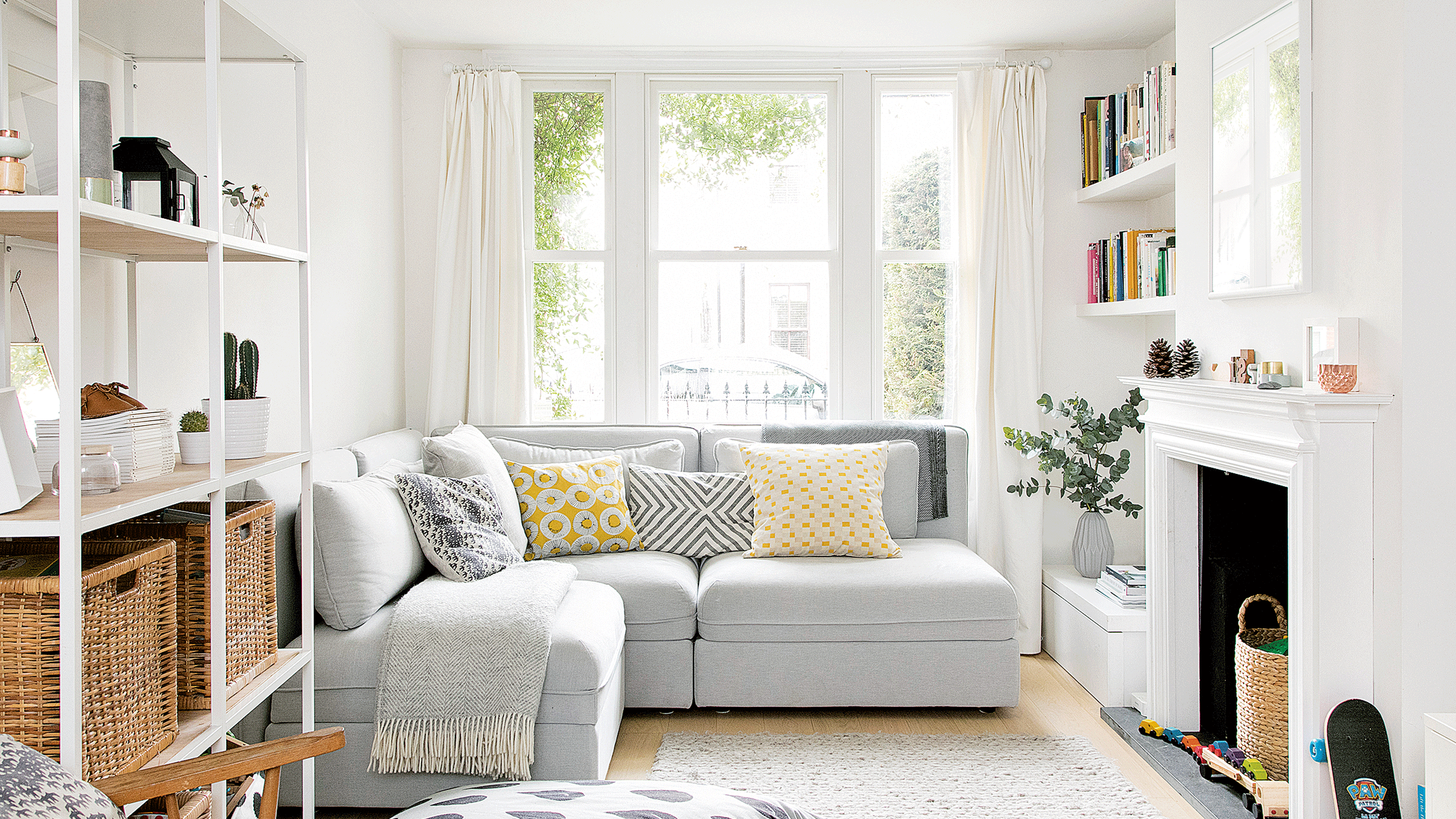 Window behind white corner sofa