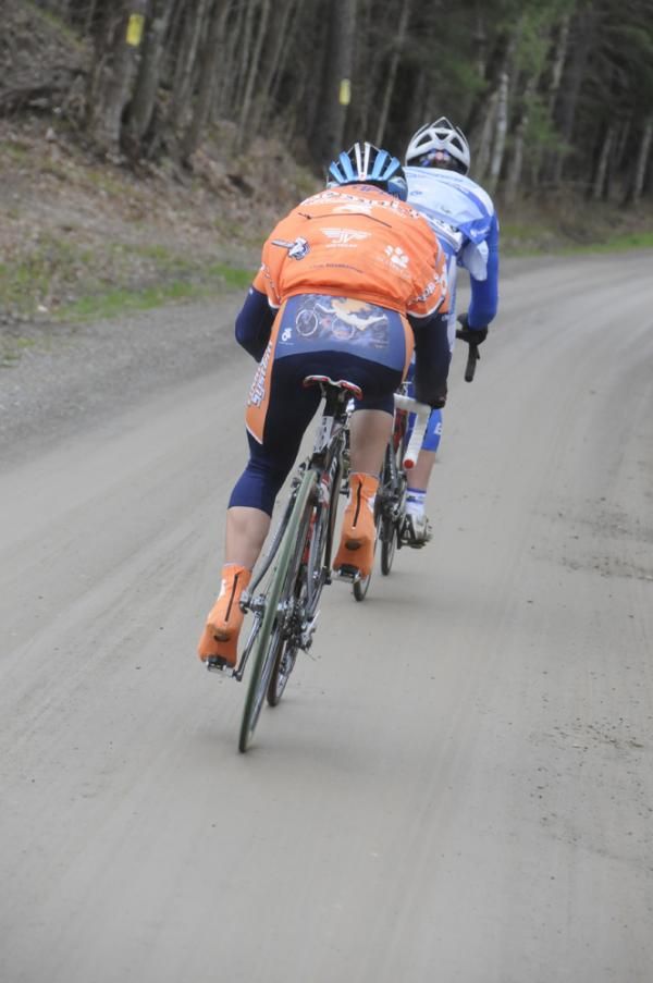 Two riders off the back on Ferguson Road, the fourth of eight dirt sections.