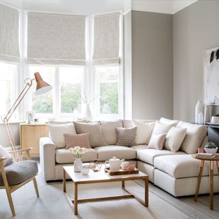 White living room with large corner sofa