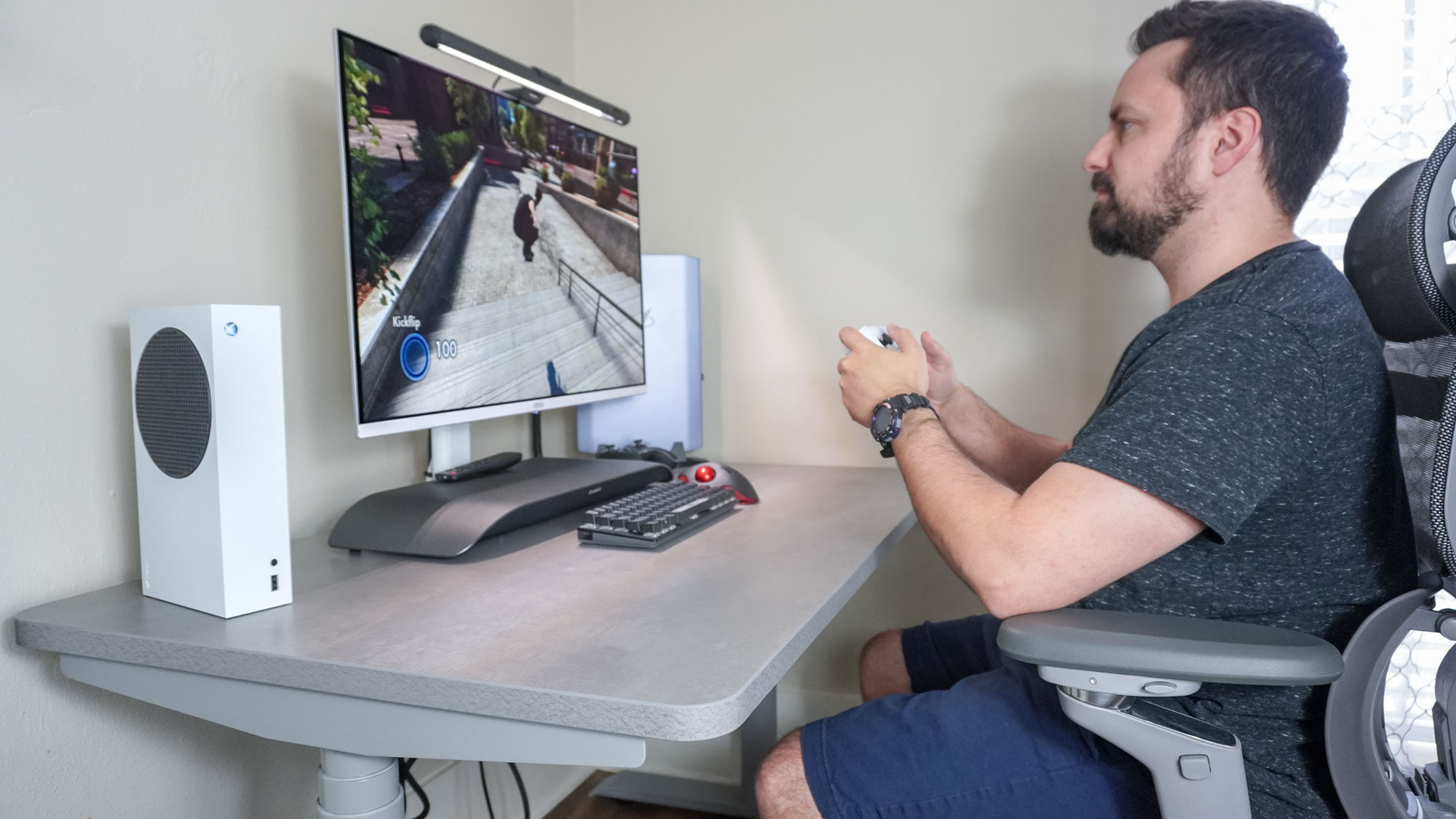 Playing Skate 3 on Xbox Series S at a desk