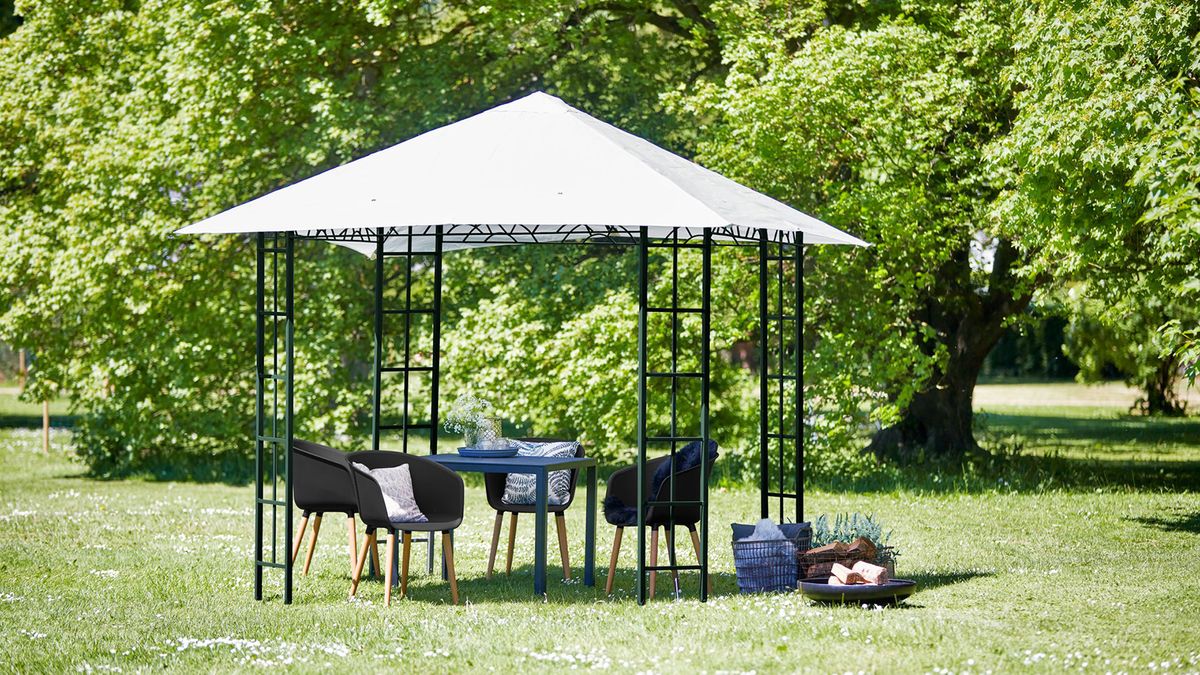 A garden gazebo on a lawn with steel frame and water-resistant polyester canopy features