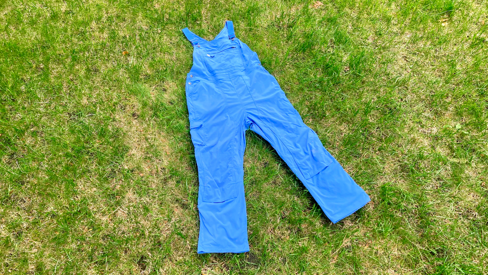 Duluth Trading Co. Heirloom Gardening bib overalls lying on lawn