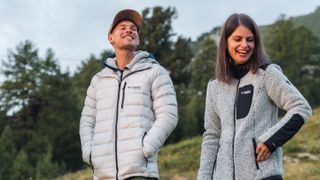 Two hikers smiling in Columbia jackets