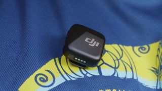 DJI Mic Mini transmitter attached to clothing