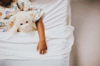 A child in a hospital bed.