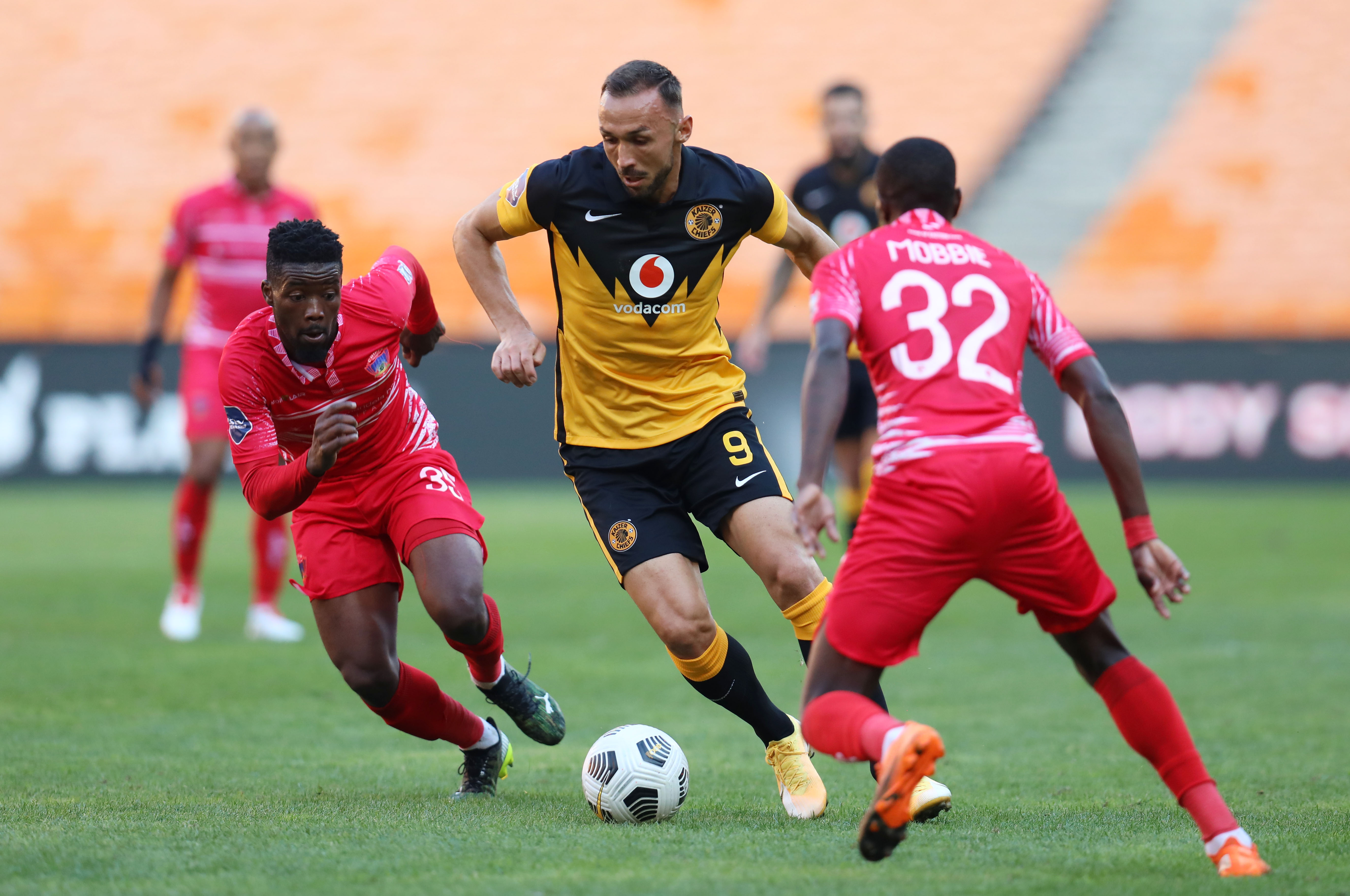Samir Nurkovic of Kaizer Chiefs challenged by Nyiko Mobbie and Mduduzi Sibeko of Chippa United