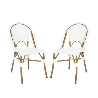 Two white and brown rattan chairs with curved backs