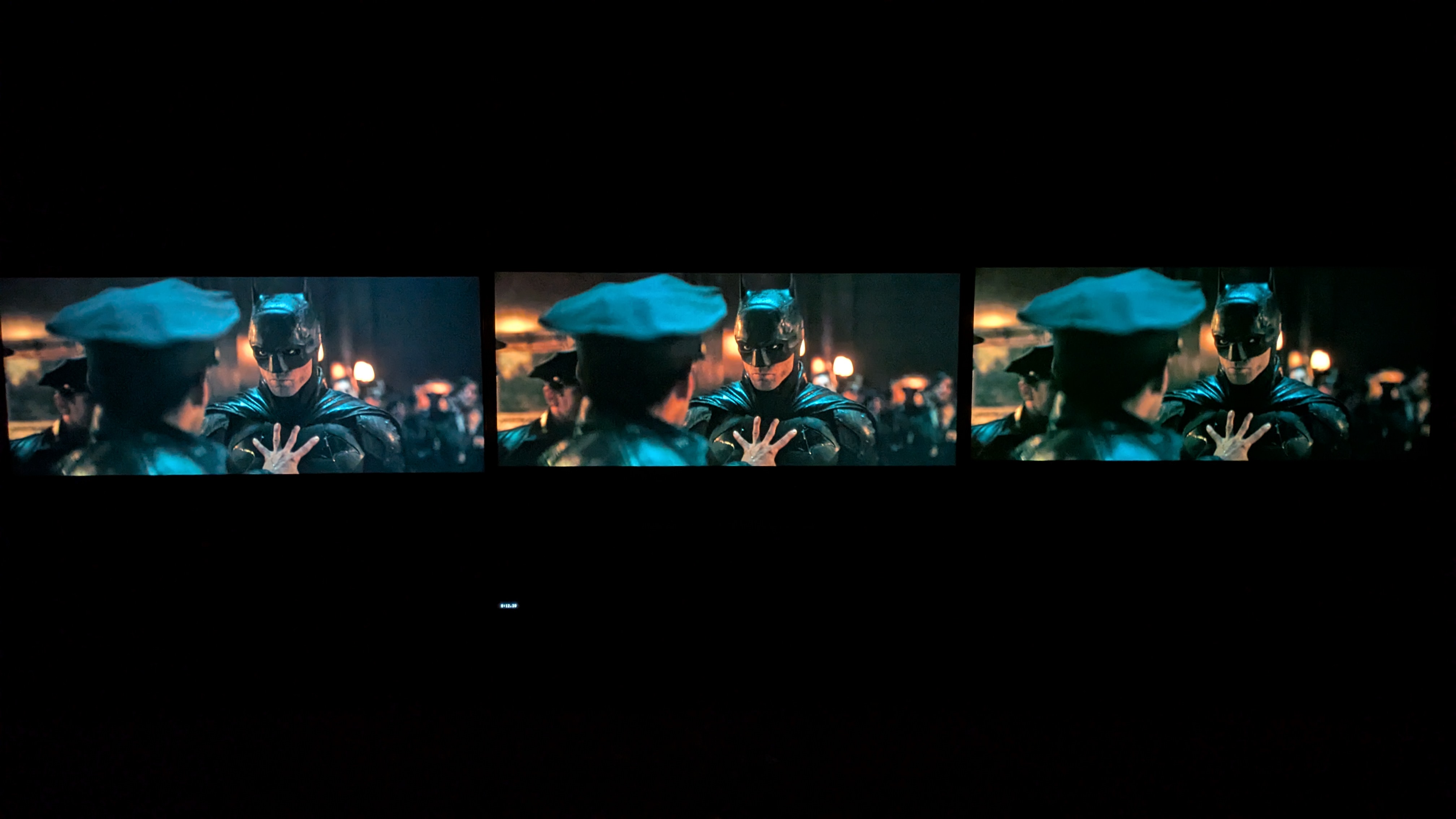 The LG G5 (left), LG C5 (middle) and LG B5 (right) showing The Batman on screen in pitch black room