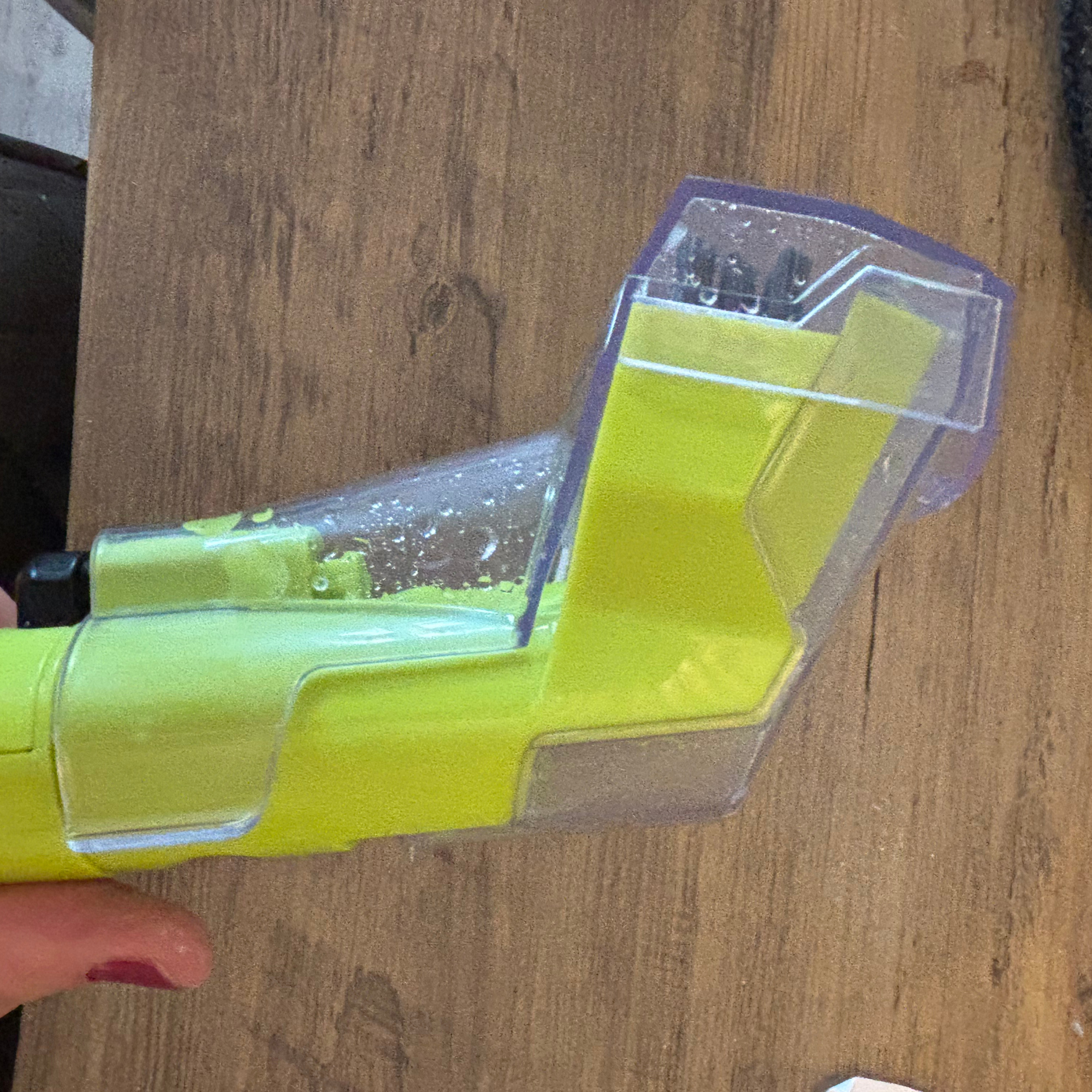 Gtech Koala Spot Cleaner cleaning brush laid on wood table