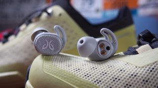 The jaybird vista 2 true wireless earbuds pictured on top of a trainer