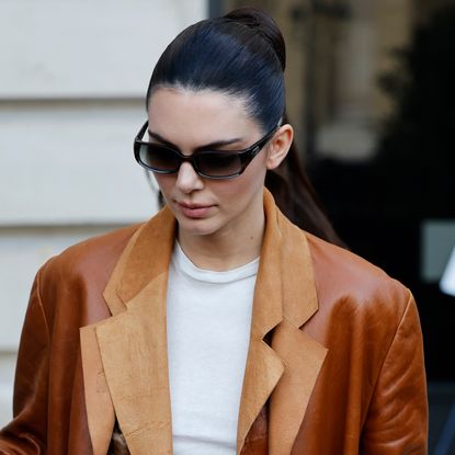 Kendall Jenner goes full cowboy-core in jeans and cowboy boots.