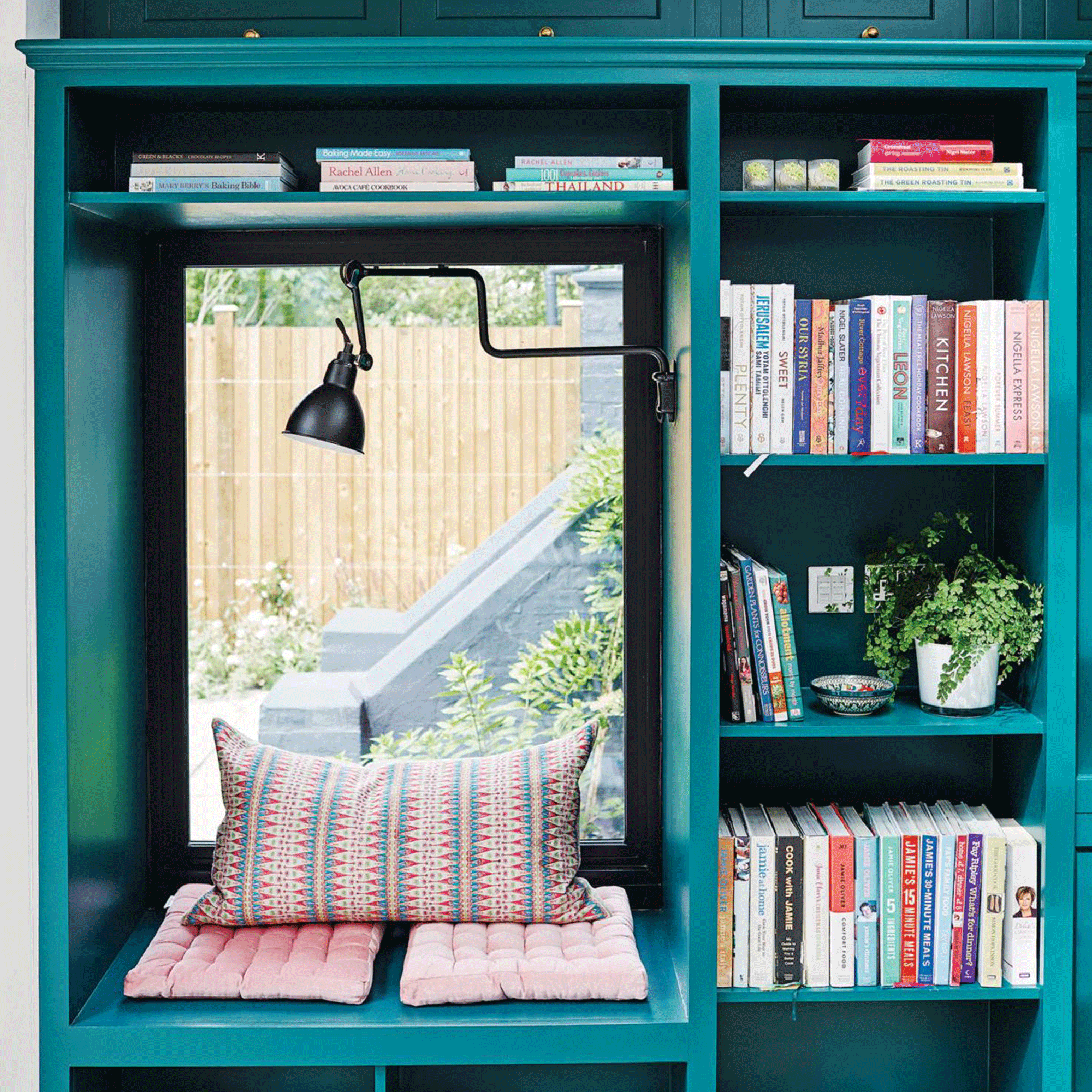 Teal shelving with seating area