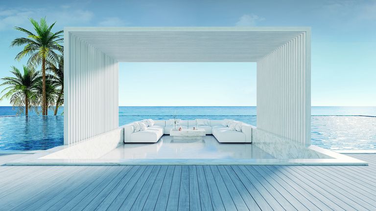 A picture of one of the world's most beautiful hotels with a sun deck and panoramic sea view