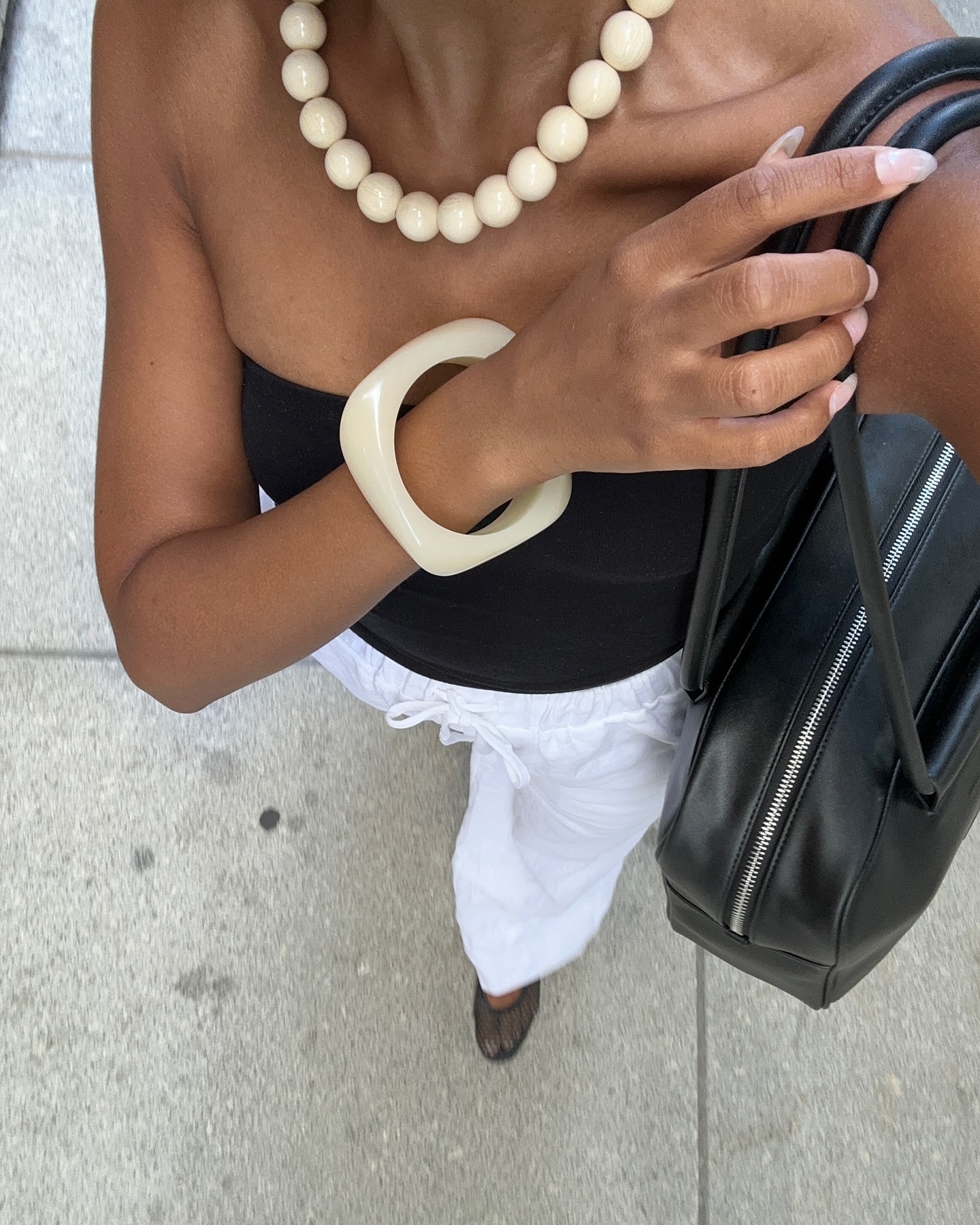 Ingrid Fagerli Edvinsen wears a cream resin bangle.