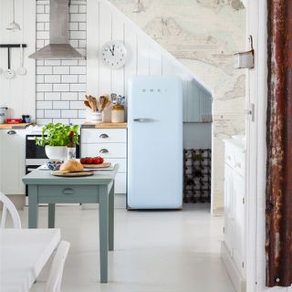 kitchen room with white tiled flooring and fridge