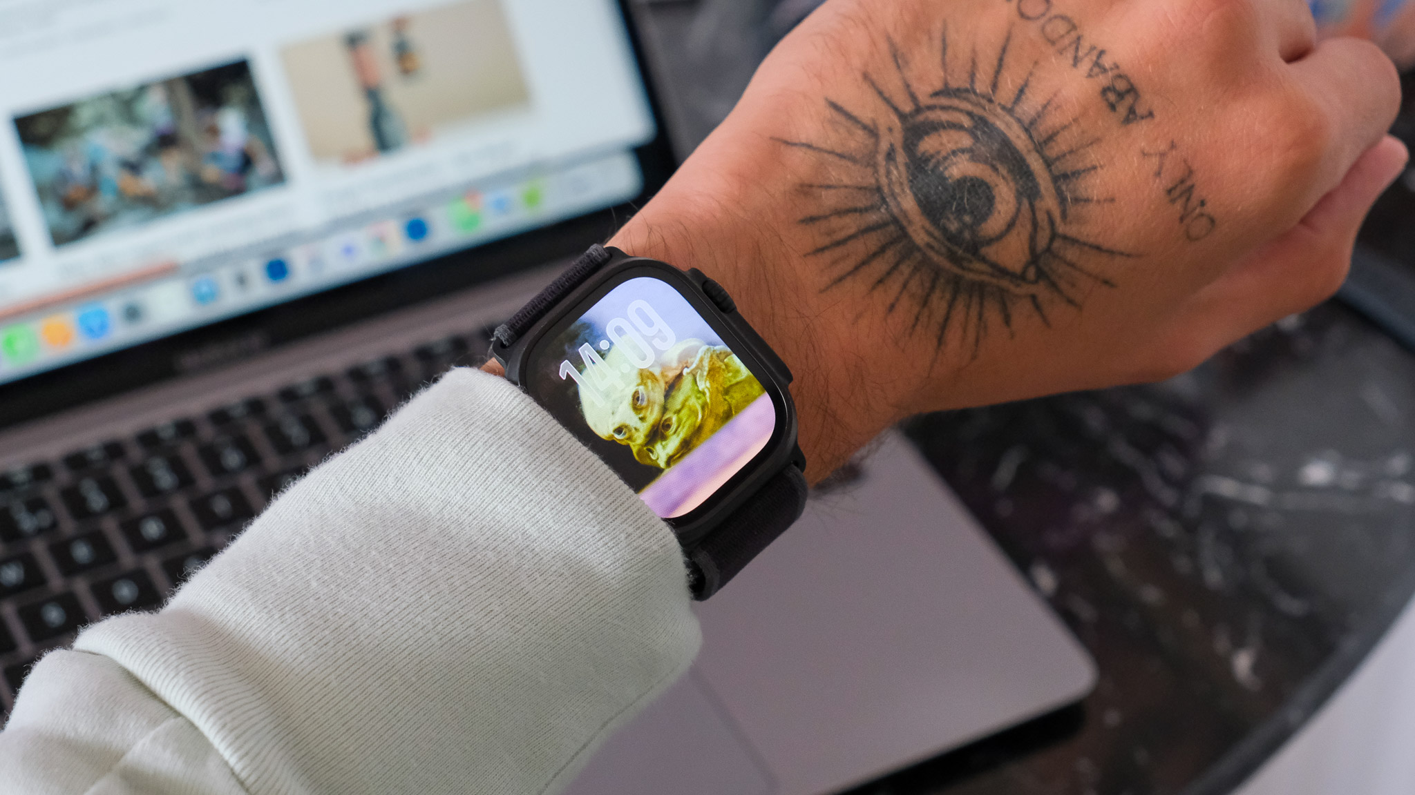 Black Apple Watch Ultra 2 displaying watchOS 26